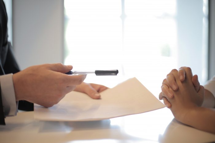 crop-businessman-giving-contract-to-woman-to-sign-3760067